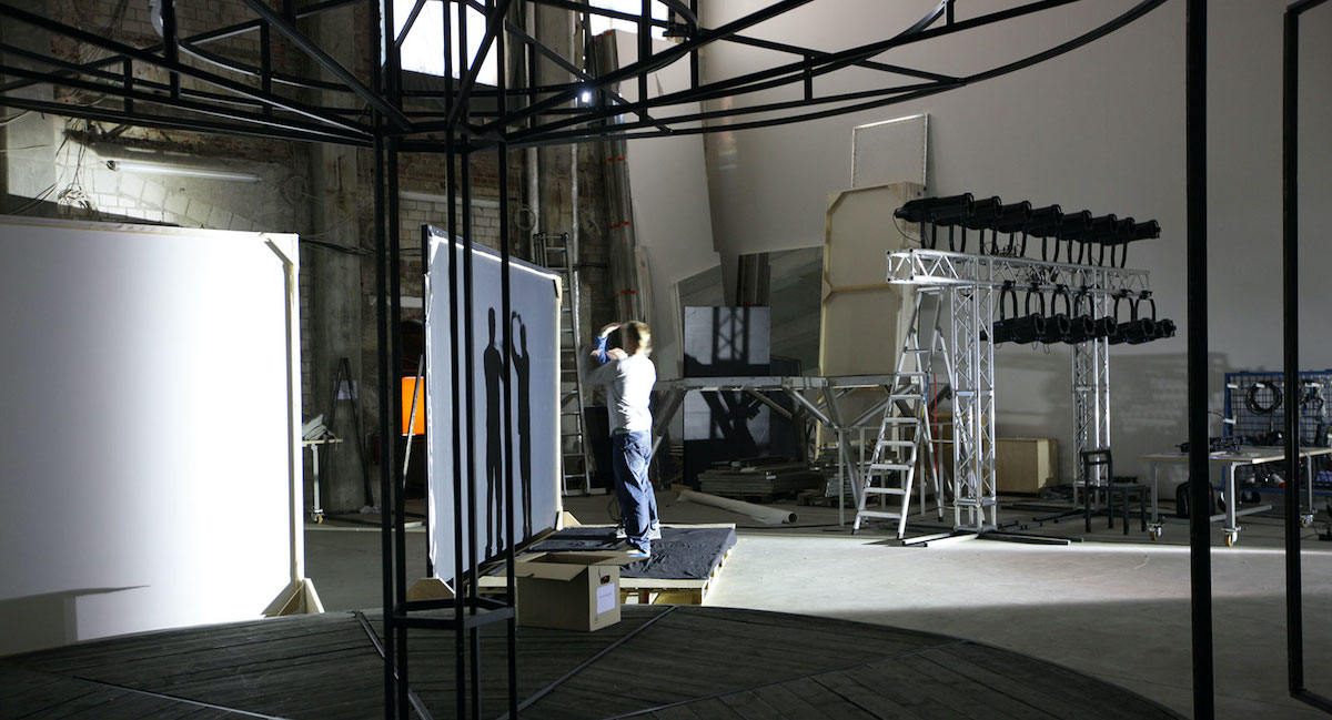 Olafur Eliasson&rsquo;s studio, a man is installing a structure in the middle