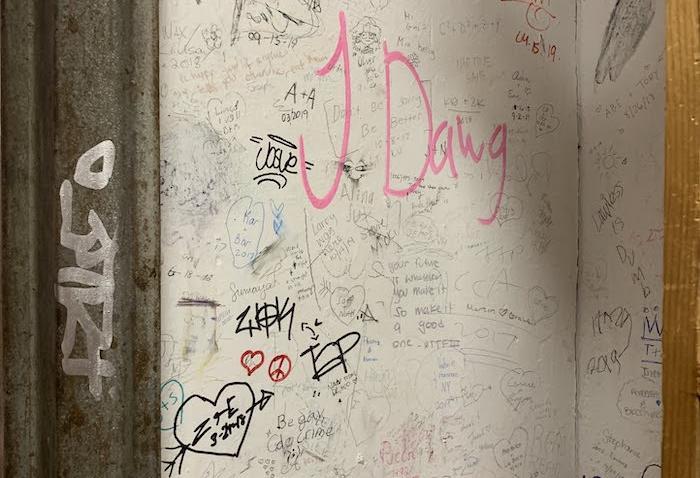 Scribbles on the wall at Strand Bookstore, with phrases like &ldquo;J Dawg&rdquo; and &ldquo;Alexey was here&rdquo;